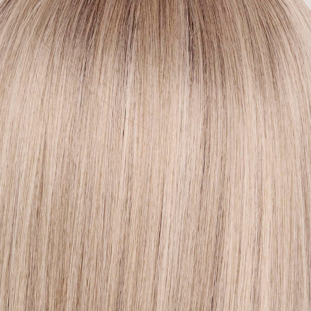Billionaire Blond   -  A sophisticated hue featuring a rich mocha chocolate root that transitions into finely woven beige, ash, and cream blond tones. The face-framing luxurious cream and white blond highlights elevate the color