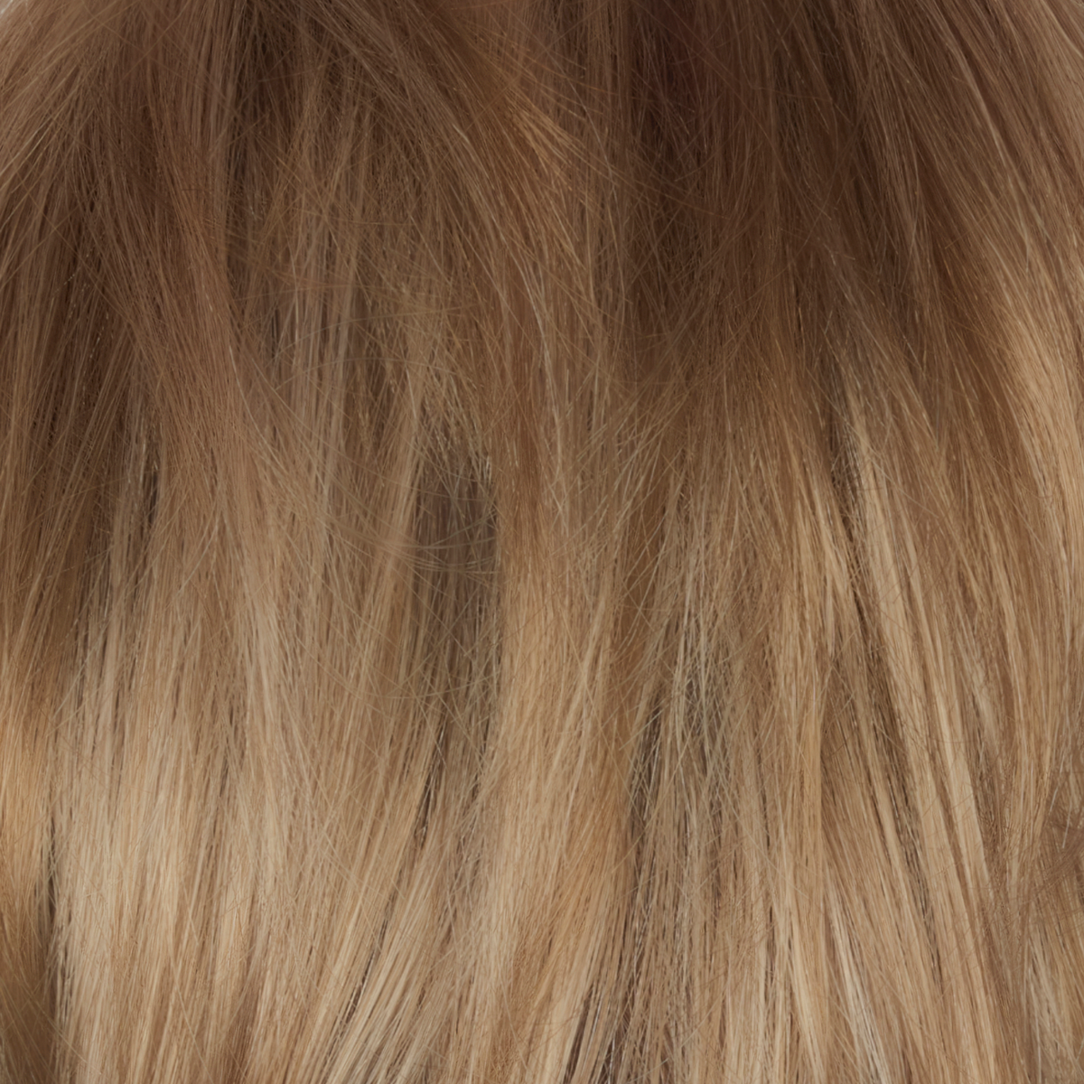 A dark/medium multi-tonal blond with a chocolate brown root regrowth that captures the essence of a summer sunset. This beautiful color is ideal for those who appreciate textured honey, ash and gold hues.