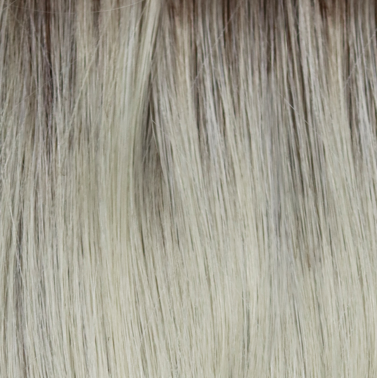 Creamy Dolce  -  A beautiful blond with a natural regrowth of a dark to medium honey brown with a whole host of tiny weaves of orchid white blonds and pale creams.