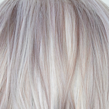Frozen Mulberry  -  A stunning hair color that combines a pale white-grey platinum base with subtle lavender and frosted berry tones delicately woven throughout. This unique blend of highlights and purple toned lowlights adds texture and elegance to the overall look.