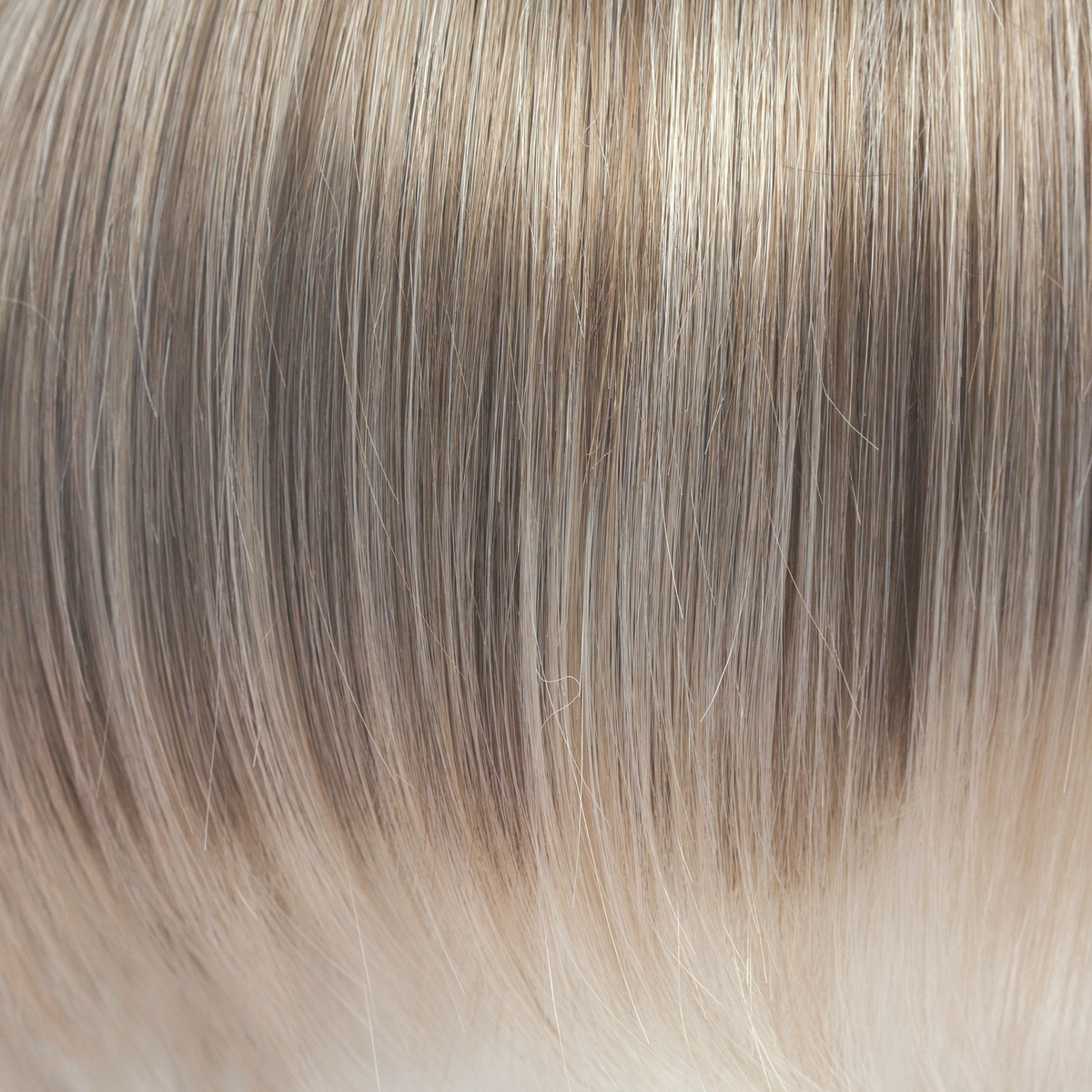 This captivating clever color has a blend of beautiful ash blond highlights and velvet blonds. Towards the ends of the hair you are hit with blocks of ice blonde tips. This Ice Blond color combination is great in any style. It is crisp and cool… we love it!