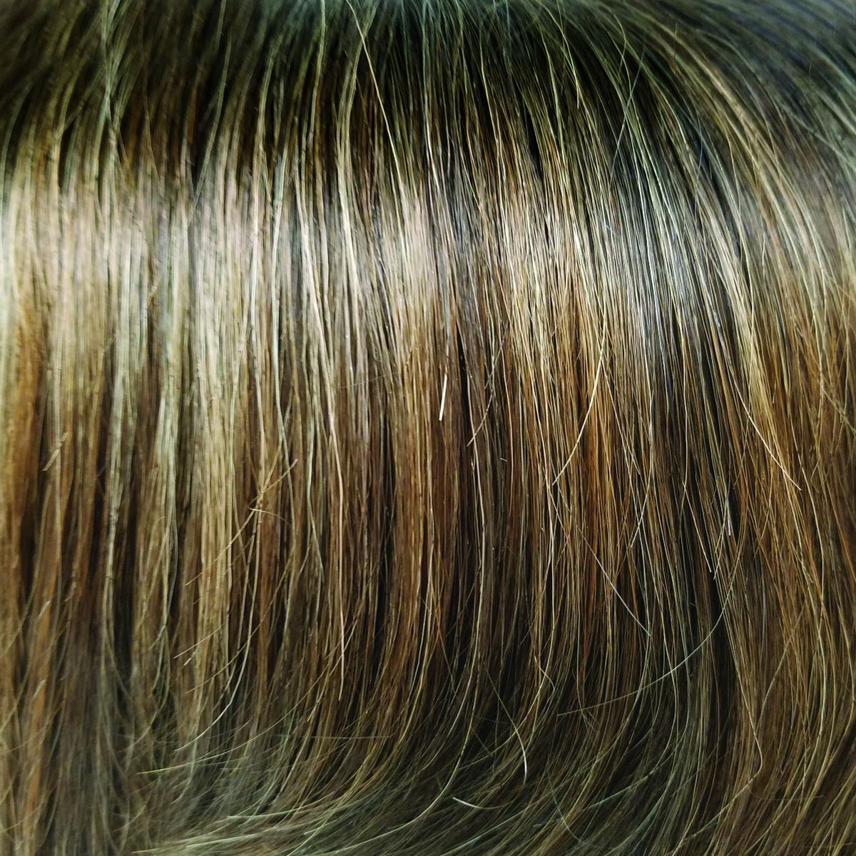 Kandy Brown-LR  -  A mixture of warm light brown and dark rich brown tones. It's natural long shadow roots compliment this trendy, realistic appearance.