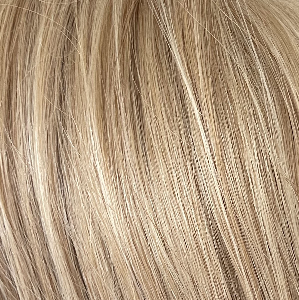 Marigold  -  A toffee toned blond, that is wonderful in any style it comes in. This pale golden blond with finely woven creamy highlights, is a real head turner!