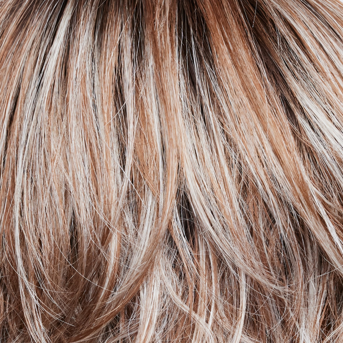 NM Melted Cinnamon  -  A medium-brown root tone that melts into the cinnamon blond base color. It's then topped off with icy blond ends.